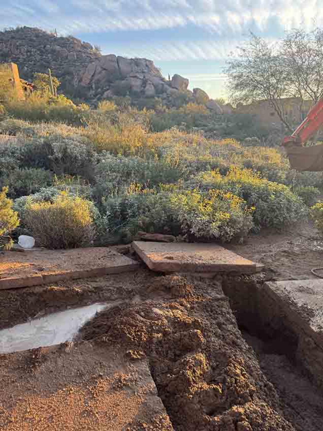 Concrete slabs removed for water main replacement excavation