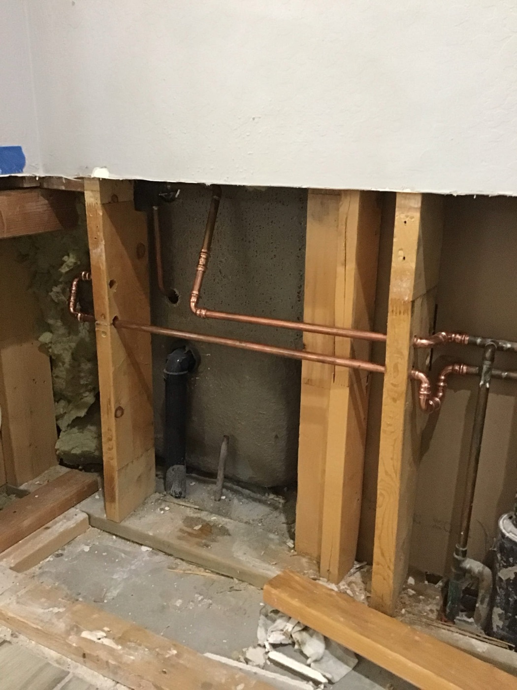 Copper water lines rerouted through wood ceiling beams