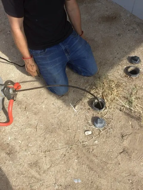 A Trident plumber cabling a main sewer line in Phoenix