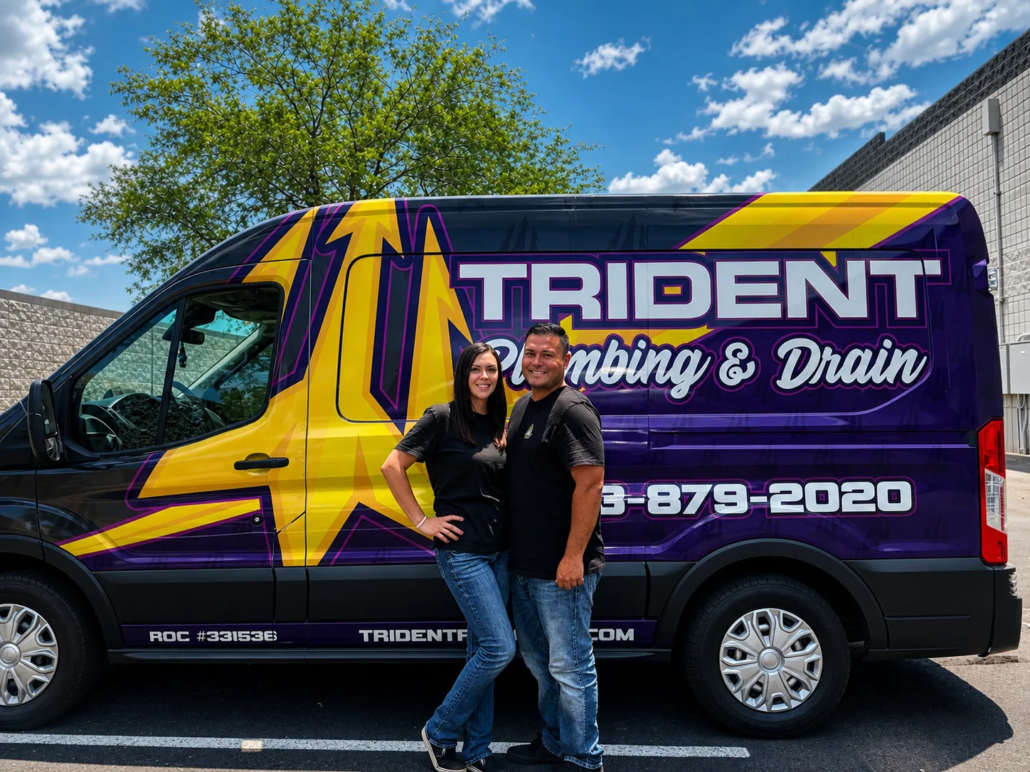 Trident Plumbing owners Shelby and Jared in front of branded service van